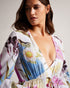ROZLYN-Swimwear-Get ready to turn heads at the beach with the gorgeous ROZLYN cover-up. Our spliced floral print catches the eye, while the deep V-neck and floaty silhouette bring plenty of elegance. With long sleeves and a gathered waist with tassels, this cover-up is both stylish and comfortable. Bring on holiday season.By choosing Ted Baker cotton products, you're supporting our investment in the Better Cotton Initiative's mission. This product is sourced via a system of mass balance and therefore may no